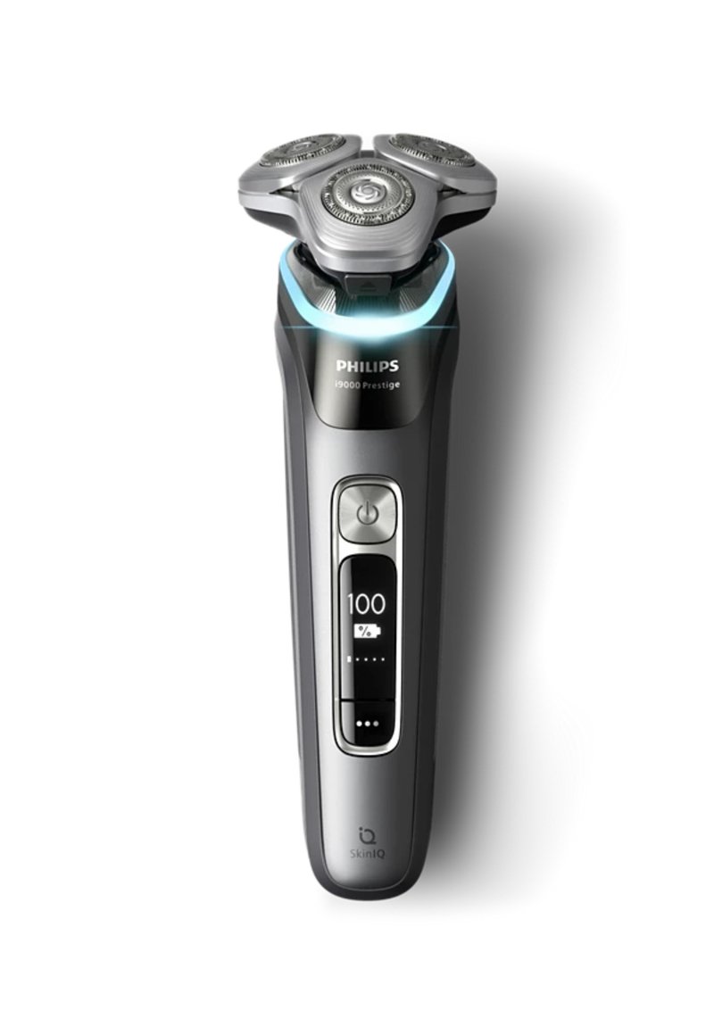 Philips i9000 Prestige electric razor, featuring a sleek black design, three circular shaving heads, illuminated control panel, and ergonomic grip.