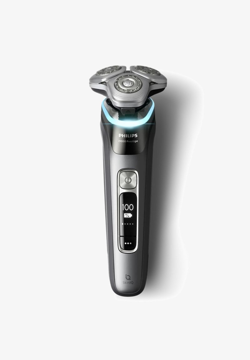 Philips i9000 Prestige elektrische scheerapparaat, met een slank zwart ontwerp, drie ronde scheerkoppen, verlicht bedieningspaneel en ergonomische grip.