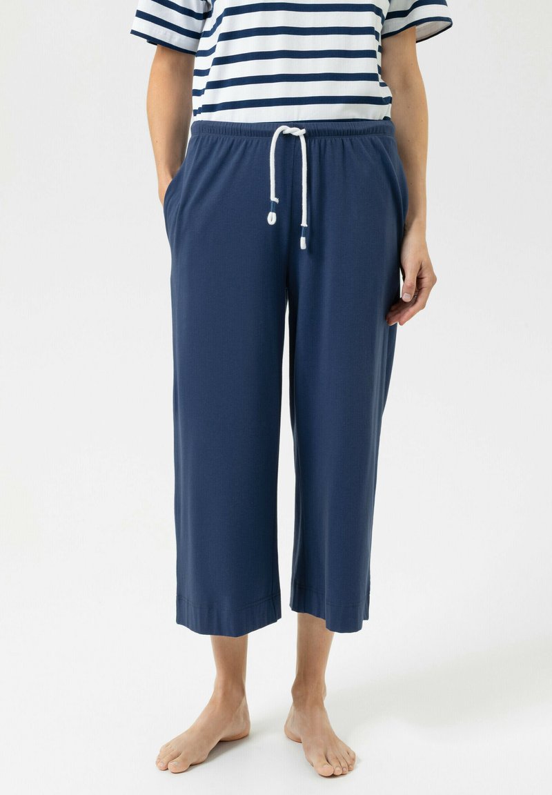 Pantalon court bleu marine en tissu doux, avec taille à cordon de serrage et poches latérales, coupe droite et bords ourlés.