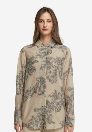 Beige Langarmbluse aus weichem Stoff mit aufwendigen floralen und Paisley-Mustern in Dunkelblau und Silber. Mit Knopfleiste.