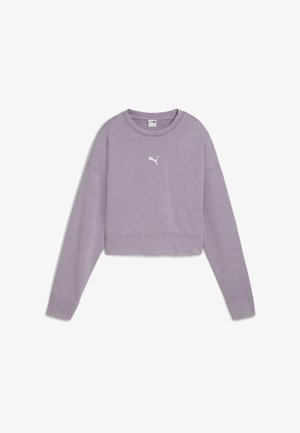 Felpa crop lilla realizzata in tessuto morbido. Presenta maniche lunghe, un colletto rotondo e un piccolo logo bianco Puma sul petto.