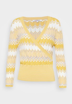 Keltainen ja valkoinen zigzag-kuvioitu pitkähihainen neulepaita V-pääntiellä ja tiukalla ribbikuitu vyötäröllä, Morgan, koko pieni.