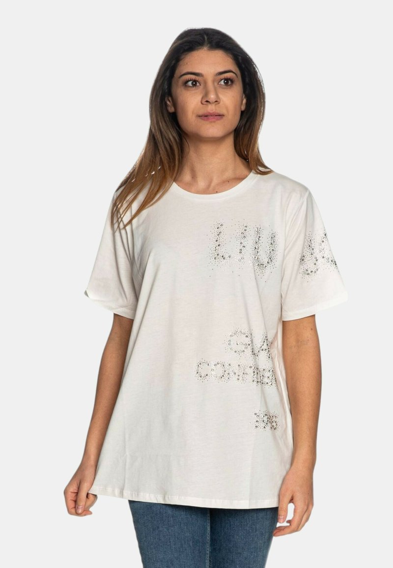 T-shirt bianca in cotone con maniche corte, caratterizzata da un design testurizzato con accenti argento e lettere stampate sulla parte anteriore, dalla vestibilità rilassata.
