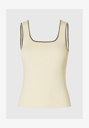 Canotta a costine di un leggero crema con scollatura quadrata. Presenta cuciture a contrasto nere lungo il collo e le armature.