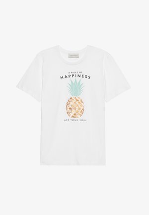 White cotton t-shirt featuring a pineapple graphic with green leaves, gold accents, and black text reading "A piece of happiness for your soul."
