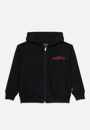 Sweat à capuche zippé noir avec texte rouge « REPLAY DENIM GOODS MFG TRADEMARK - 1981 » sur la poitrine et poignets et ourlet côtelés.