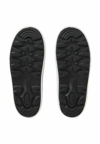 Black rubber shoe soles with textured tread patterns and white borders. Sizes indicated: 34/35. Durable design for traction and support.