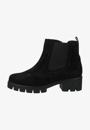 Black suede ankle boot featuring an elastic side panel, chunky sole with grooves, and a pull tab at the back for easy wear.