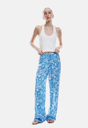 Blaue Blumenmuster-Hose mit weißen Designs, aus leichtem Stoff. Lockere Passform mit elastischem Bund und Kordelzug.