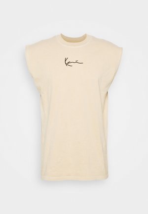 Beige cotton t-shirt with dropped shoulders, round neckline, and a black cursive "Kani" logo on the front. Smooth texture and relaxed fit.