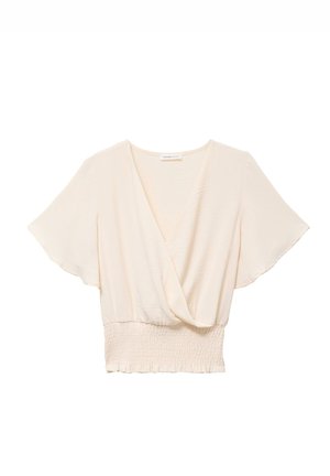Crèmekleurige korte mouwen blouse met V-hals overslag en brede geplooide tailleband.