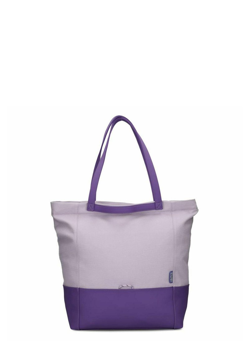 Tote bag met een zachte lavendelkleurige canvas body en een donkerpaars onderstuk. Twee paarse hengsels om te dragen. Geen zichtbare patronen of hardware.