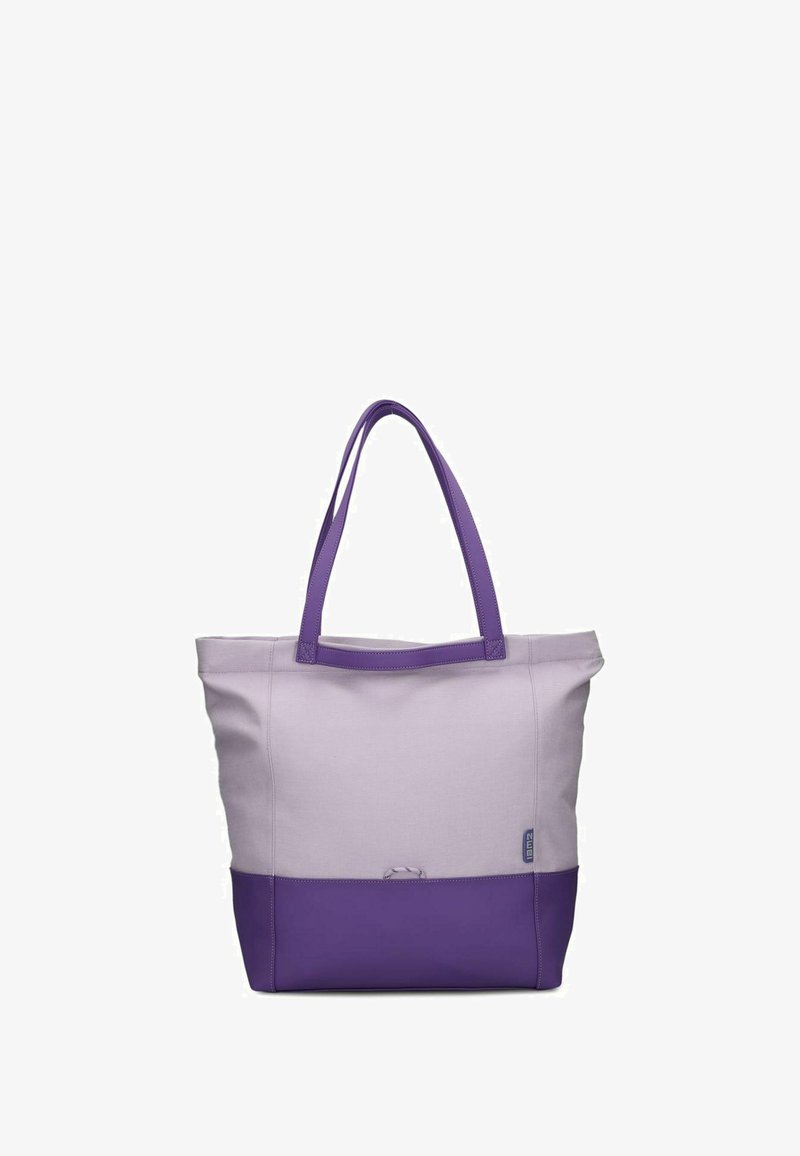 Borsa tote con un corpo in morbido tessuto lavanda e un fondo viola scuro. Doppi manici viola per il trasporto. Nessun motivo o accessorio visibile.