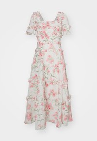 Robe midi blanche à imprimé floral rose, manches courtes bouffantes, encolure carrée et volants horizontaux sur le corsage et la jupe.