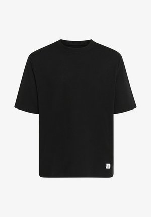 T-shirt nero a maniche corte realizzato in cotone. Presenta un collo rotondo e un piccolo etichetta bianca con "M 73" in basso a sinistra.