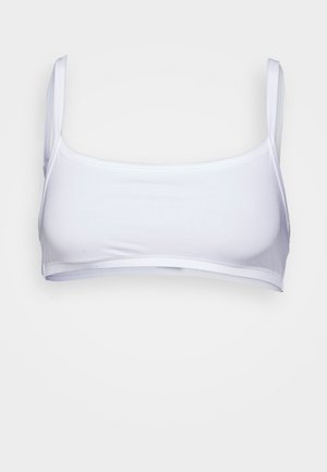 Weiße, enganliegende Bralette mit dünnen, verstellbaren Trägern, aus glattem, dehnbarem Material. Einfaches Design, keine sichtbaren Beschläge oder Verzierungen.
