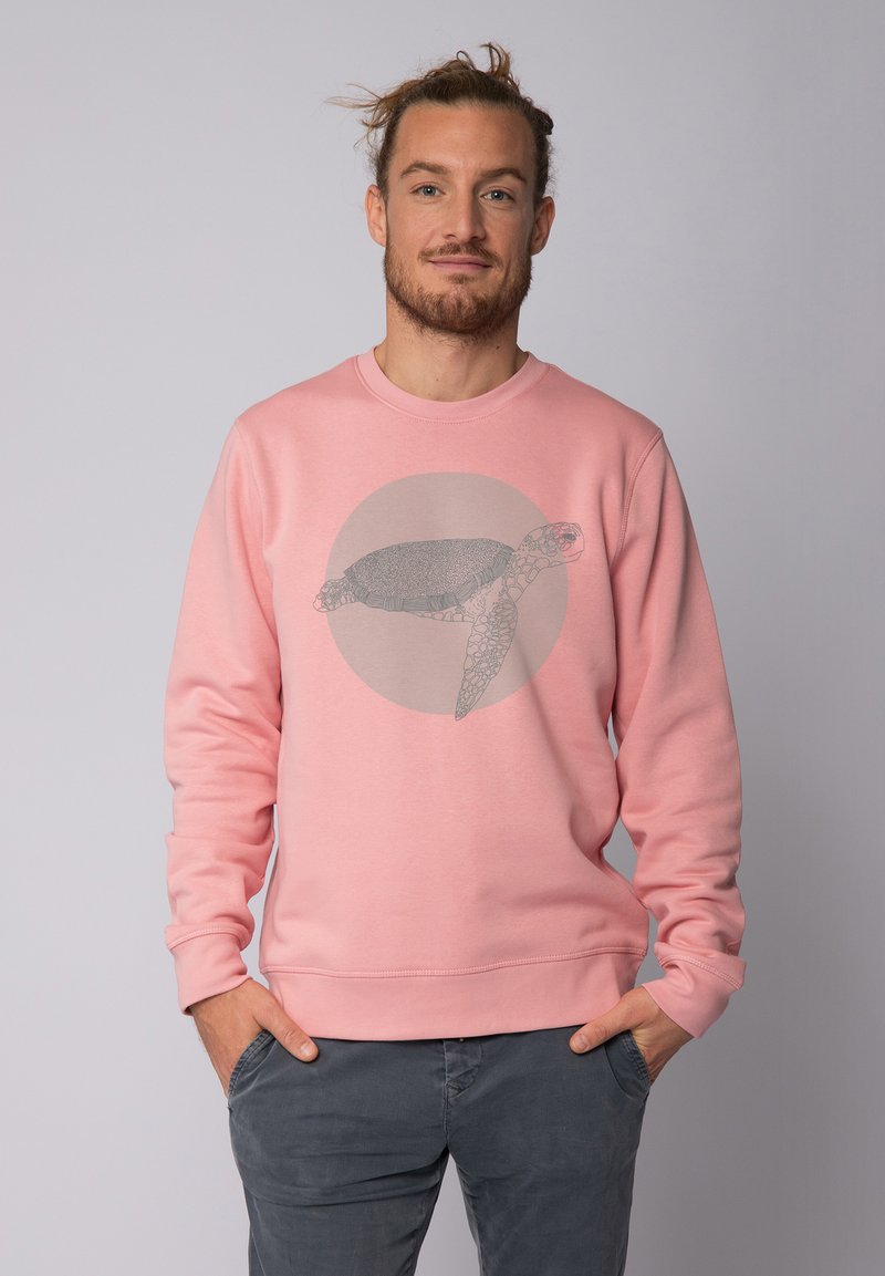 Hellrosa Sweatshirt aus Baumwollmischung mit einem großen grauen Meeresschildkröten-Graphic in der Mitte der Vorderseite. Lange Ärmel und gerippte Bündchen.