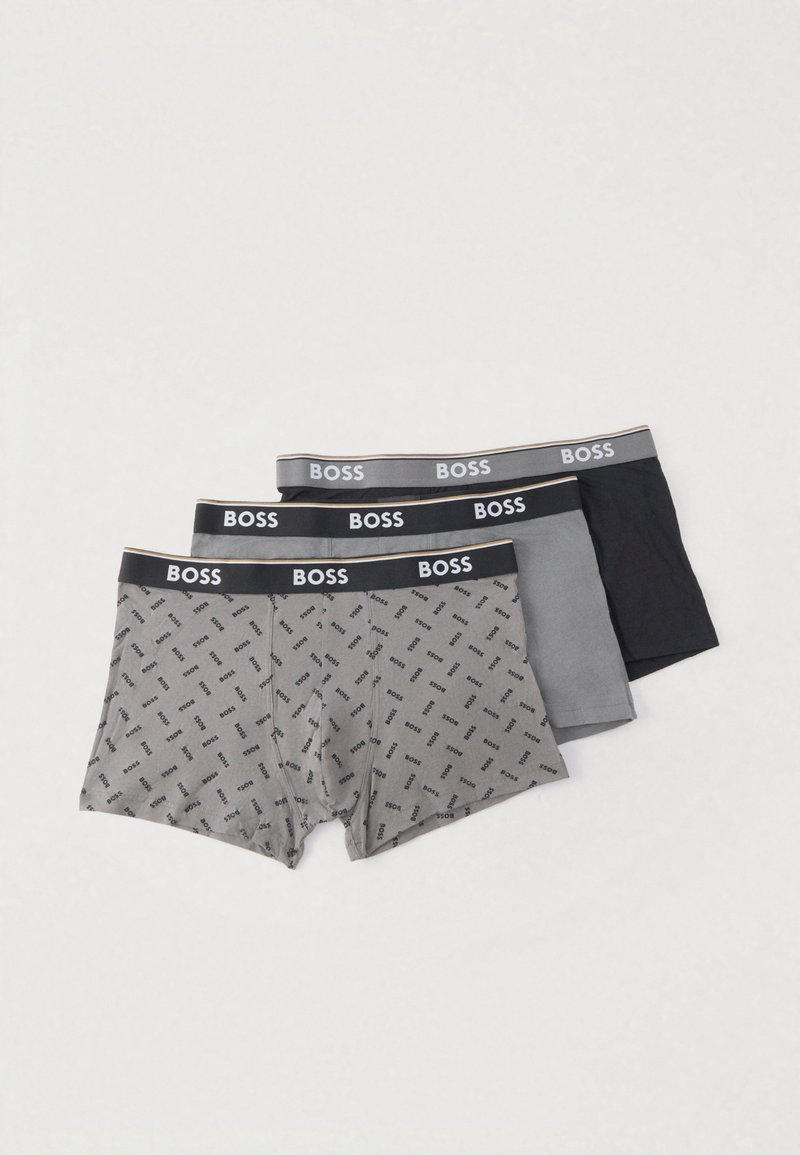 Three pairs of boxer shorts: one gray with a logo pattern, one solid gray, and one solid black. All feature a black waistband with "BOSS" text.