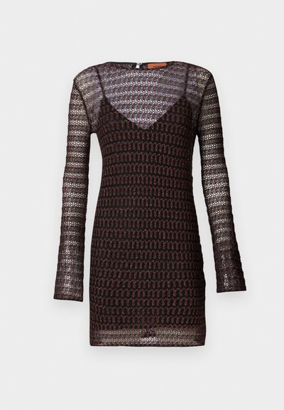 Knit dress with long sleeves, featuring a dark base with metallic thread patterns. V-neckline and fitted silhouette. Textured surface.