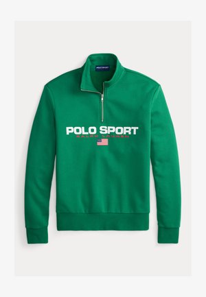 Zaļš flīsa pulovers ar puszipa apkakli, uz tā ir liels balts "POLO SPORT" logotips, sarkans "RALPH LAUREN" teksts un neliels ASV karoga simbols.