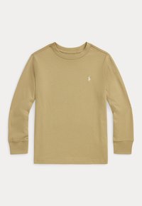 Beżowa koszula z długim rękawem, wykonana z bawełny, z okrągłym dekoltem, dopasowanymi mankietami oraz małym haftowanym logo na piersi. Gładka tekstura.