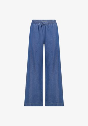 Wijde blauwe denimbroek met elastische tailleband en trekkoord, weergegeven op een witte achtergrond.