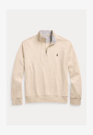 Beige fleece-tröja med halv-zippad krage. Har en ljusgrå innerkrage och en liten broderad logotyp på bröstet. Mjuk textur.