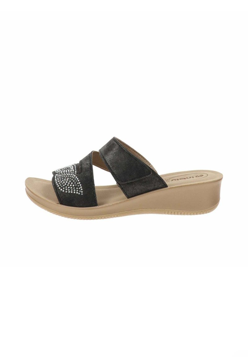 Infradito neri con due fasce incrociate, arricchite da rhinestones; presentano un tacco a zeppa e una suola beige per un contrasto.
