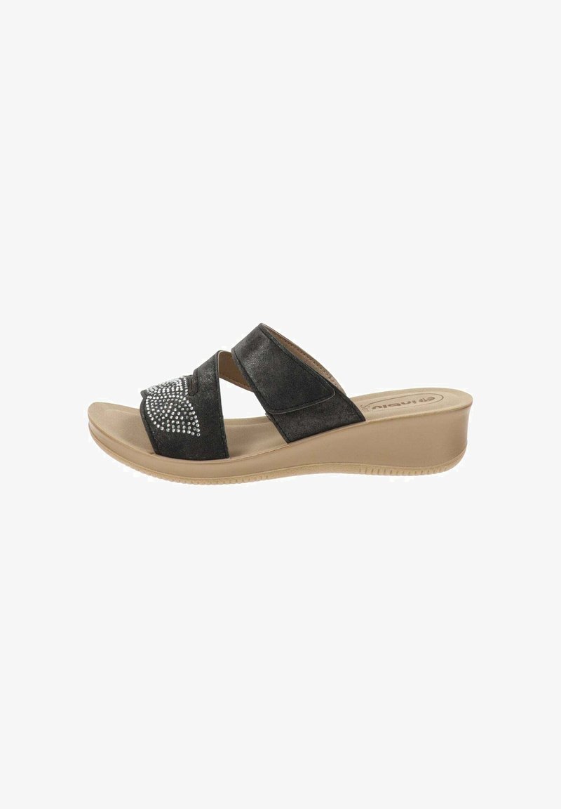 Infradito neri con due fasce incrociate, arricchite da rhinestones; presentano un tacco a zeppa e una suola beige per un contrasto.