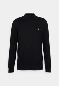 Pull noir à manches longues avec un col montant, fabriqué en tissu doux. Présente un petit logo jaune sur la poitrine gauche.