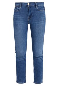 Jeans de denim azul con un corte ajustado, diseño de cinco bolsillos, cremallera frontal y cierre de botón. Ligera desgastación cerca de los bolsillos.