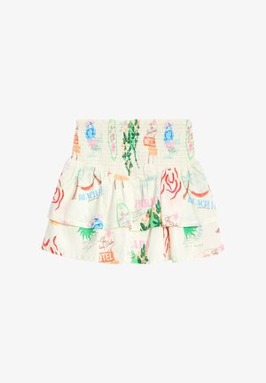 Jupe en tissu blanc avec des imprimés tropicaux colorés, dotée d'une taille smockée, de volants superposés et de divers graphiques liés aux vacances.