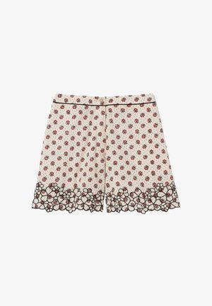Shorts crème avec imprimé floral rouge et bordure de dentelle noire fleurie le long de l'ourlet, avec un bouton et un passepoil noir à la taille.