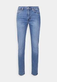 Jeans azul claro con un diseño clásico de cinco bolsillos. Fabricados en denim, presentan un corte recto y un ligero desvanecimiento en la parte frontal.