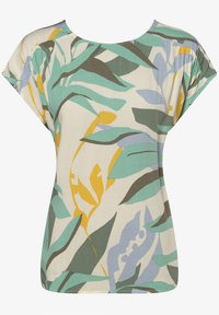Kortärmad topp i lätt tyg med ett blommönster som har gröna, blå och gula blad på en krämfärgad bakgrund. Slät textur.