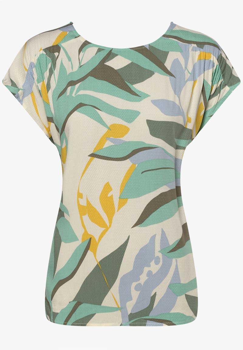 T-shirt à manches courtes en tissu léger avec un motif floral comportant des feuilles vertes, bleues et jaunes sur un fond crème. Texture lisse.