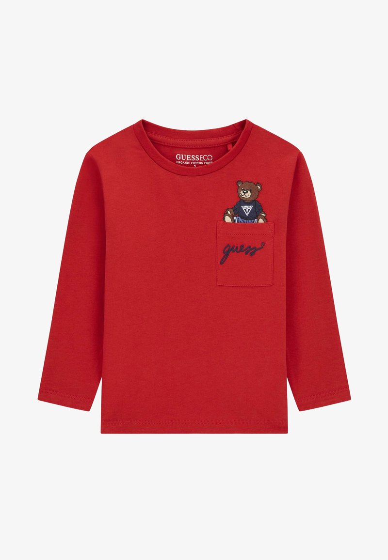 Rotes Langarmoberteil aus Bio-Baumwolle. Mit Bären-Stickerei und einer Tasche mit "guess"-Text. Weicher Stoff, Rundhalsausschnitt.