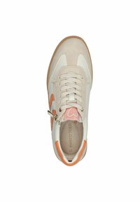 Sneaker with a cream leather upper, peach accents, suede toe cap, lace-up front, and side zipper detail. Rubber outsole for traction.