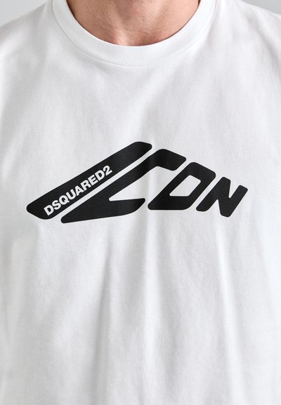 White cotton t-shirt featuring a bold black graphic design with the text "DSQUARED2 ICON" in varied letter styles and angles.