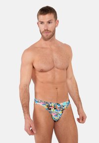 Floral-patterned swim briefs featuring a vibrant mix of colors on a light background, elastic waistband, and form-fitting design.