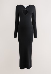 Čierne rebrované šaty s dlhými rukávmi, s výstrihom v tvare kľúčovej dierky a bočnými rozparkami v leme pre komfort pohybu. Mäkký pletený materiál.