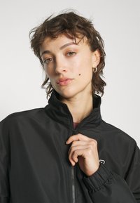 New Balance SPORT JACKET - Treniņjaka - black