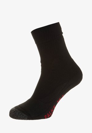 Calzini neri alla caviglia con texture a coste, punta rinforzata e lettering del marchio rosso sulla suola. Realizzati in tessuto elastico per il massimo comfort.