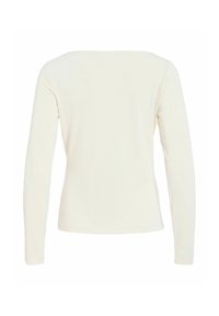 Vue de dos d'une chemise simple à manches longues, blanc cassé, à ourlet droit et sans motifs ni logos visibles.