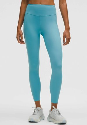 WUNDER TRAIN HIGH-RISE POCKETS ANKLE LENGTH - Bežecké legíny - washed blue