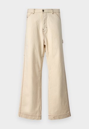 Pantaloni largi bej din bumbac, cu fermoar și nasture, cu cusături contrastante și buzunare laterale.