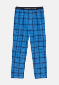 Pantalons de nuit à carreaux bleus en tissu doux, dotés d'une taille élastique noire avec le logo "TOMMY HILFIGER". Le design comprend des carreaux bleus et noirs.