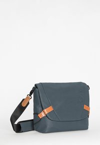 Blue leather messenger bag with a fold-over flap, tan accents, and adjustable black strap. Features sleek design and smooth texture.