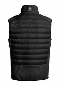 Gilet rembourré noir avec un col haut, texture matelassée et une poche zippée à l'arrière. Tissu doux et panneaux latéraux en maille respirante.