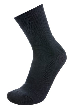 Calza nera alla caviglia realizzata in tessuto a coste. Presenta una punta e un tallone rinforzati. Design semplice e senza cuciture, senza loghi o motivi visibili.